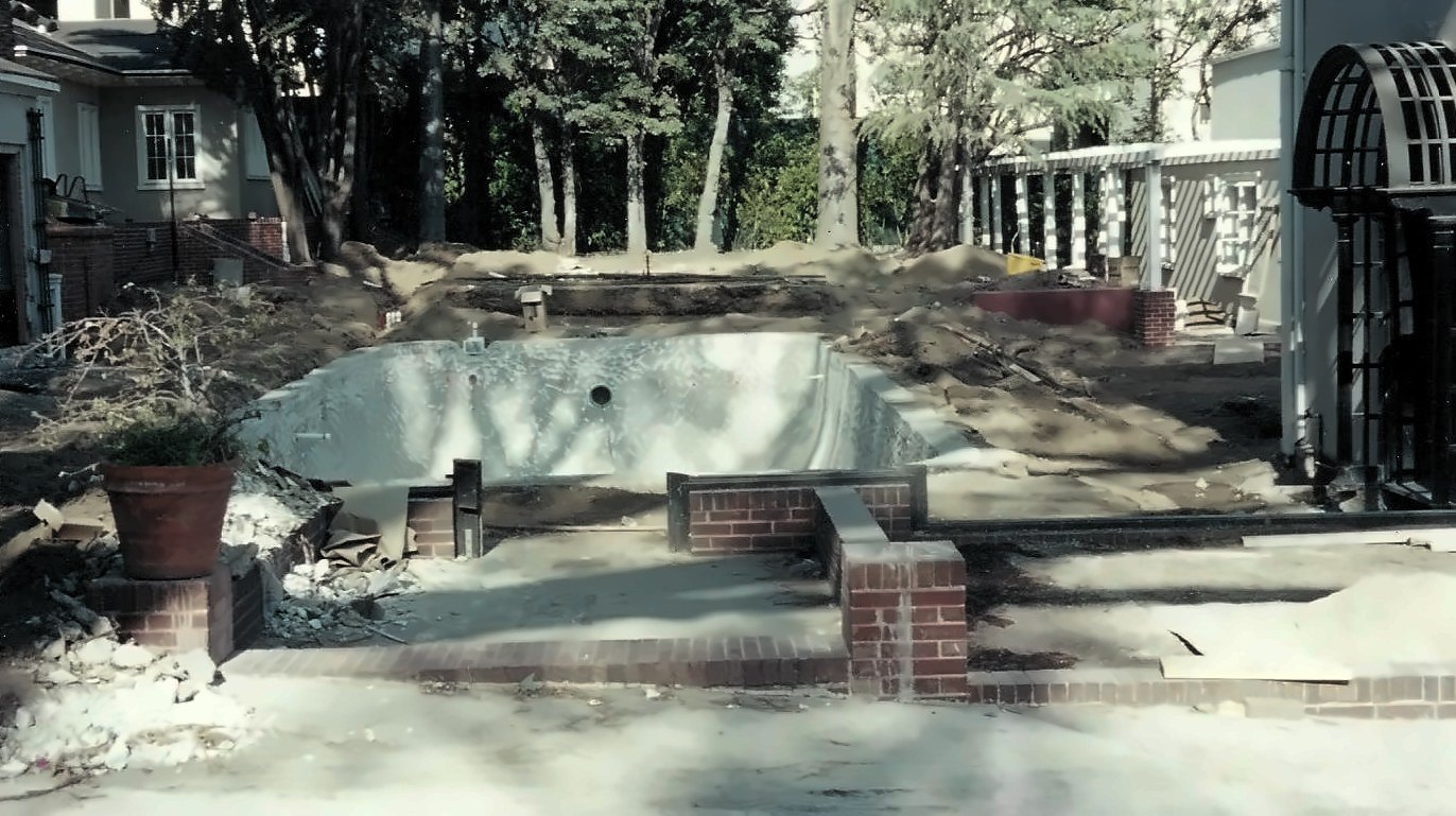 The yard and pool, redone, during