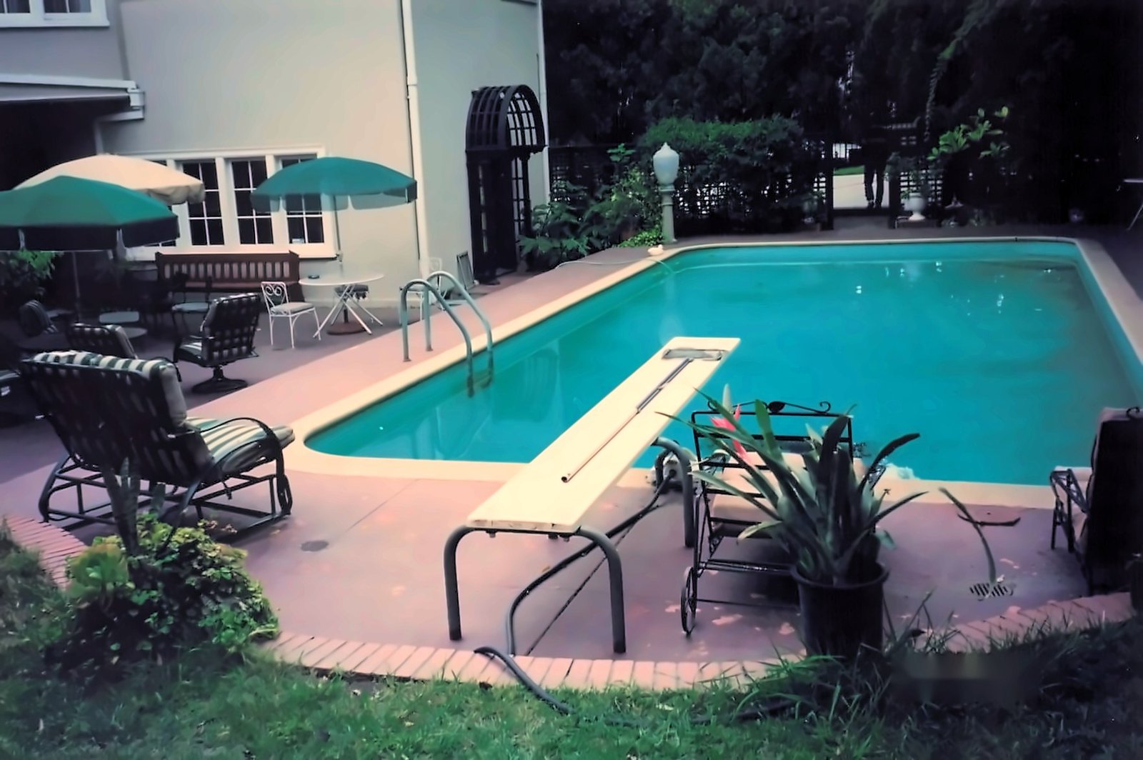 The yard and pool, redone, before